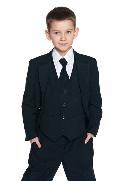 Cute young boy in the black suit - Фото, зображення