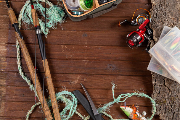 Fishing tacles on wooden background. Mockap for advertisment and publishing. - Photo, Image
