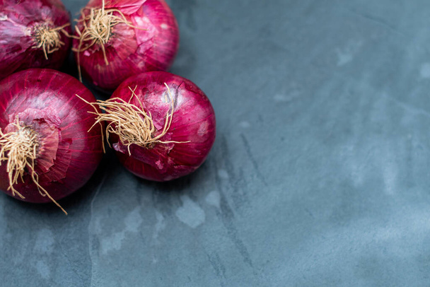 onion and garlic on stone table - Zdjęcie, obraz