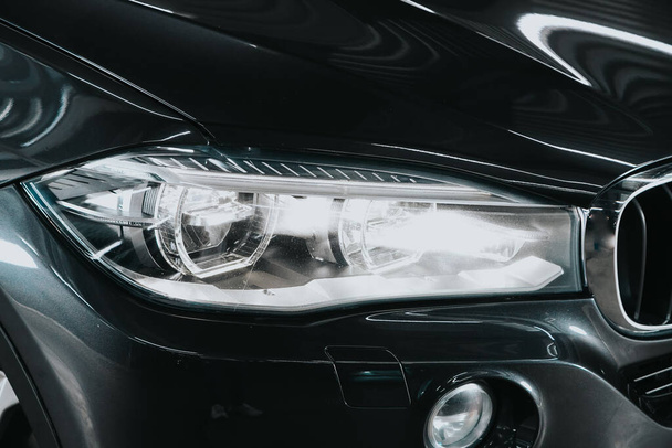 Novosibirsk, Russia  September 05, 2020: BMW X5, Exterior detail . `close up  of modern  car xenon lamp headlight - Fotoğraf, Görsel