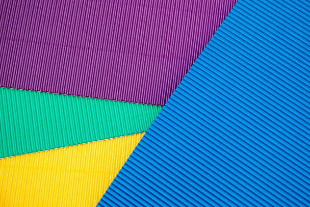 段ボールの応用紙の背景.青、黄色、緑、紫の色。テキストの場所 - 写真・画像
