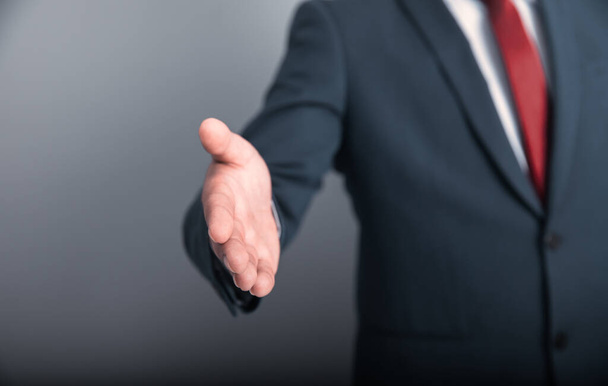 business man  open hand on gray backgroun - Фото, зображення