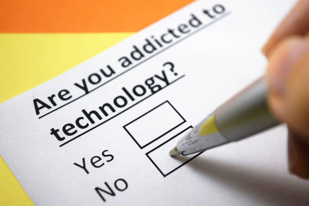 A person is answering question about technology addiction. - Photo, Image