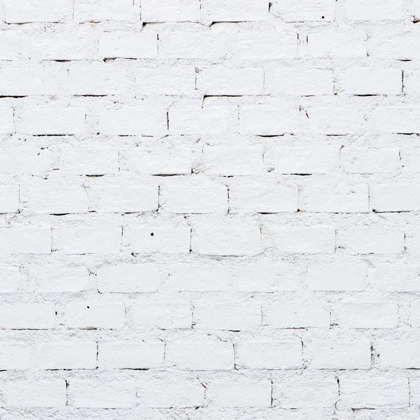 een witte bakstenen muur - Foto, afbeelding