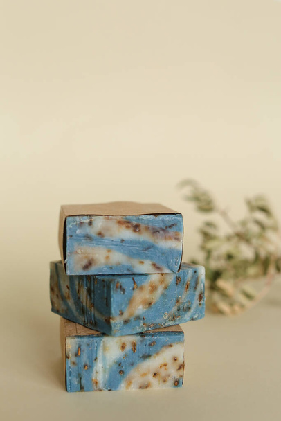 Three blue handmade organic soaps with essential oils on background with copy space. - Fotó, kép