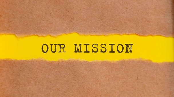 OUR MISSION message written under torn paper. Business, technology, internet concept. - Photo, Image