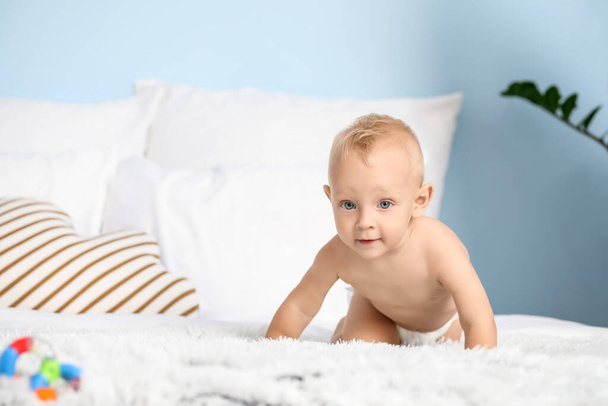 Cute little baby on bed at home - Photo, Image