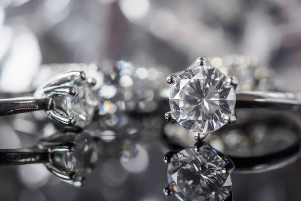 Luxury Jewelry diamond rings with reflection on black background - Фото, изображение