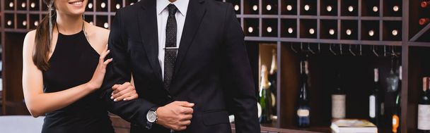 Website header of elegant woman touching hand of boyfriend in suit in restaurant  - Photo, Image