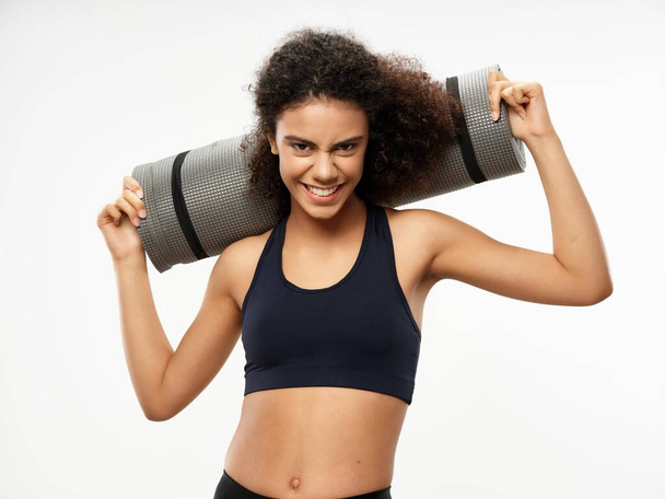 Sportive woman slim figure exercise mat  - Фото, изображение