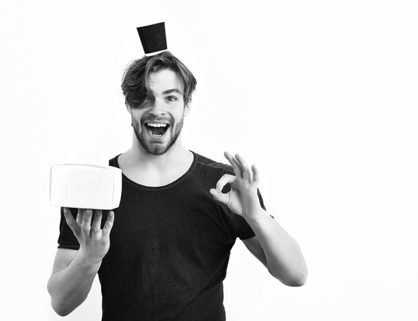 Caucasian sexy young macho holding male box with coffee cup - Foto, Imagem