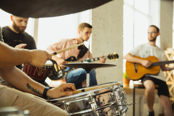 Musician band jamming together in art workplace with instruments - Zdjęcie, obraz