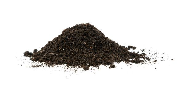 Close up one heap of black humus soil isolated over white background, low angle side view - Photo, Image