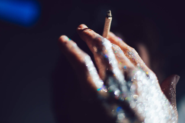 Hands with smoke and glitter with man - Fotó, kép
