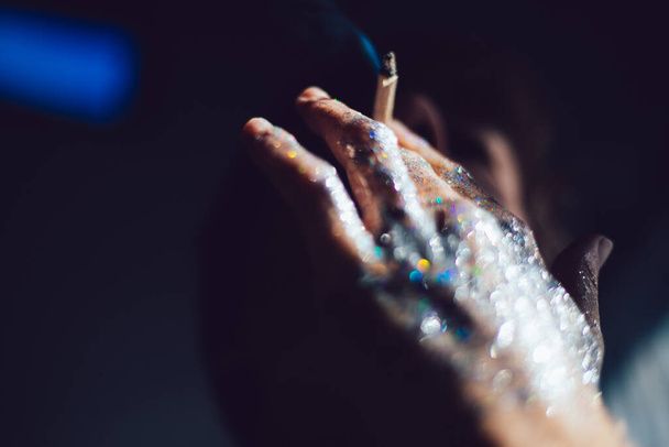 Hands with smoke and glitter with man - Foto, Bild
