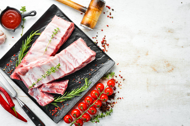 Meat. Raw Pork ribs with rosemary. Top view. Rustic style. - Fotografie, Obrázek