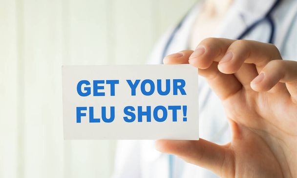 Get Your Flu Shot card in hands of Medical Doctor - Foto, afbeelding
