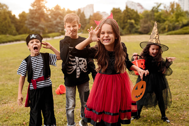 Little devil celebrating Halloween with friends - Photo, Image
