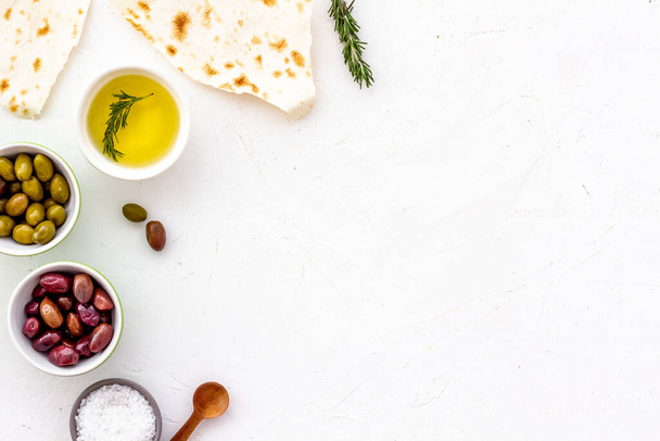 Italian olives, oil, bread - appetizer and snacks - top view copy space - 写真・画像