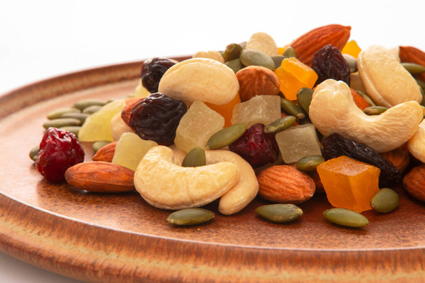 The plate contains nutritious mixed nuts - Photo, Image