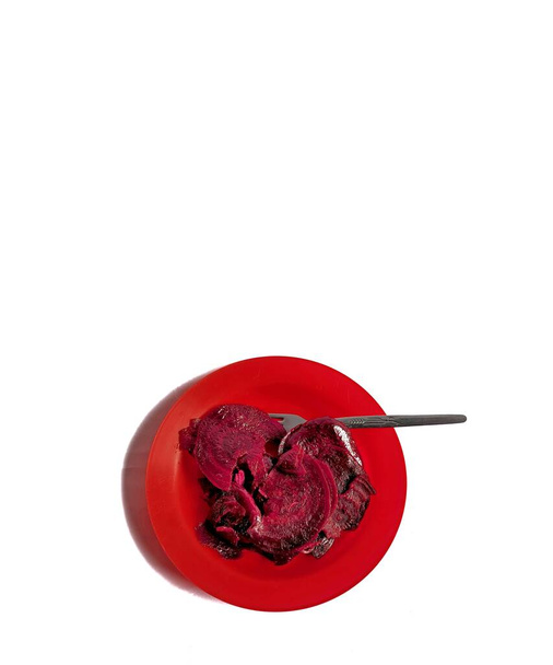 Sliced Beetroot on a plate on white background. vegan food - Фото, зображення