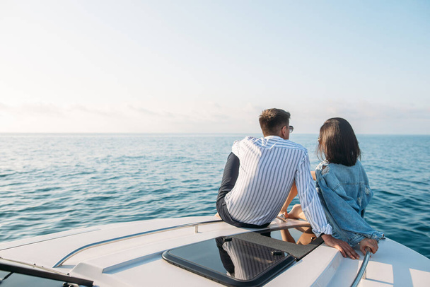 Caucasian couple in love relaxing on yacht bow, Travelling lifestyle concept - Fotoğraf, Görsel
