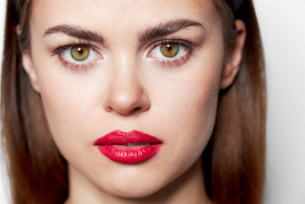 Woman with red lips face close up studio  - Fotó, kép