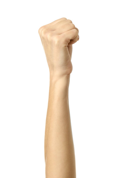 Hand clenched in a fist. Vertical image. Woman hand with french manicure gesturing isolated on white background. Part of series - Photo, Image