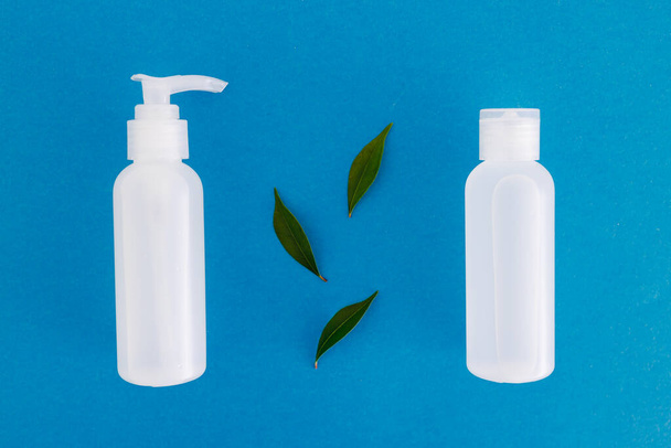 natural and cruelty-free beauty products concept, group of lotions and moisturizers with green leaves - Photo, image