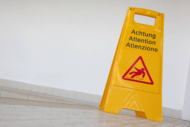 Wet floor sign by indoor swimming pool, selective focus - Photo, Image