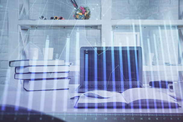 Forex Chart hologram on table with computer background. Double exposure. Concept of financial markets. - 写真・画像