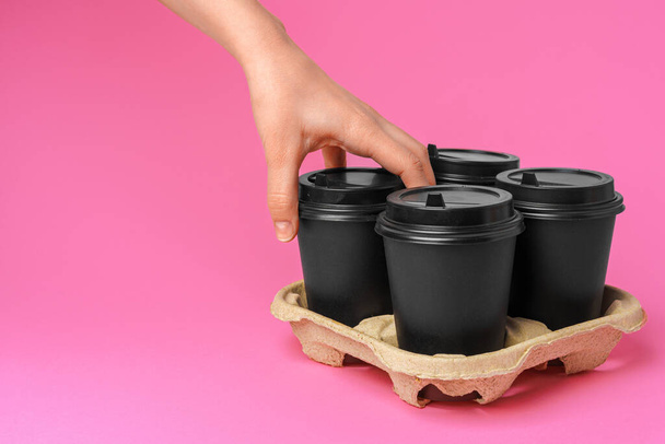 Coffee delivery. Human hand holding takeaway coffee cup - Φωτογραφία, εικόνα