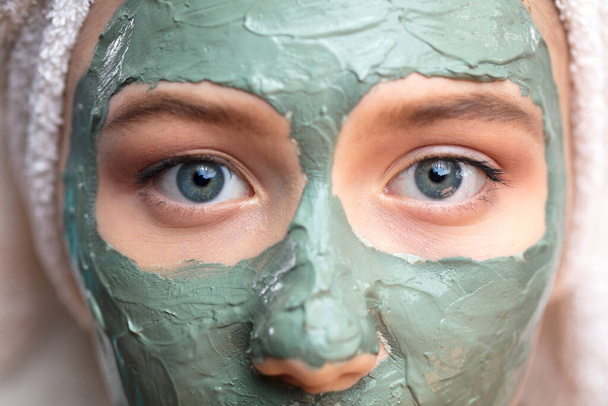 Macro shot woman face with clay facial mask on face isolated, clos up, macro - Photo, Image