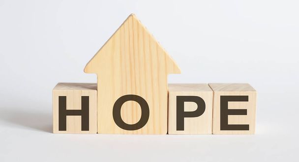 Wooden blocks with the word HOPE , house. The concept of the high cost of rent for an apartment or home. Interest rates are rising. Real estate market. - Photo, Image