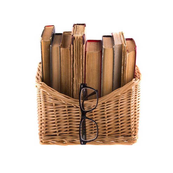 Stack of old antique books in basket - Photo, Image