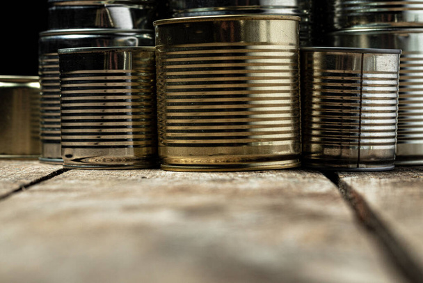 Tin cans with food on the table. - Фото, зображення