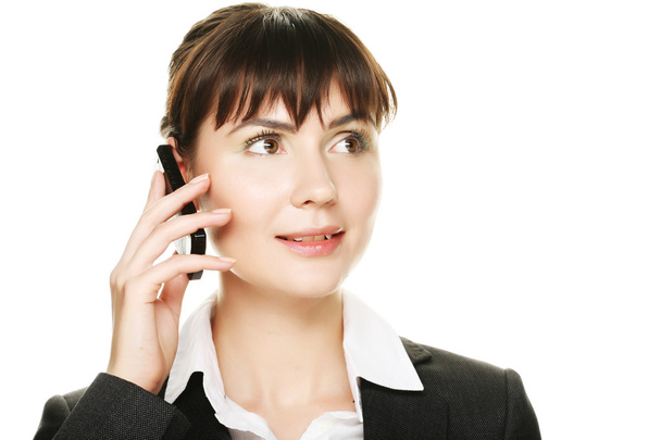Business woman talking on cell phone - 写真・画像