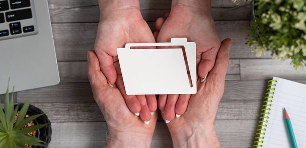 Concept of data protection with paper folder in hands - Photo, Image