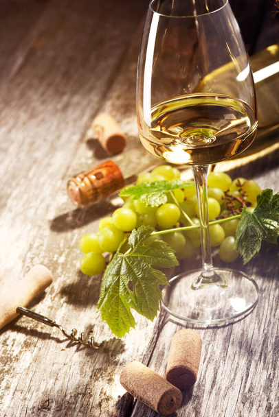 Glass of white wine on vintage wooden table	 - Foto, Bild