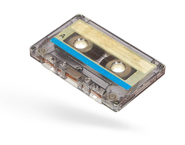 Old used audio cassette isolated on white background with clipping path - 写真・画像