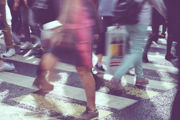 The concept of blurry pedestrian traffic on a city street - Photo, Image