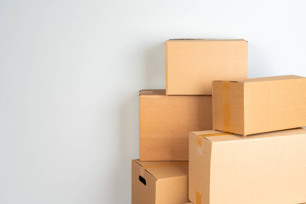 Close up photo of a stack of moving boxes - Fotó, kép