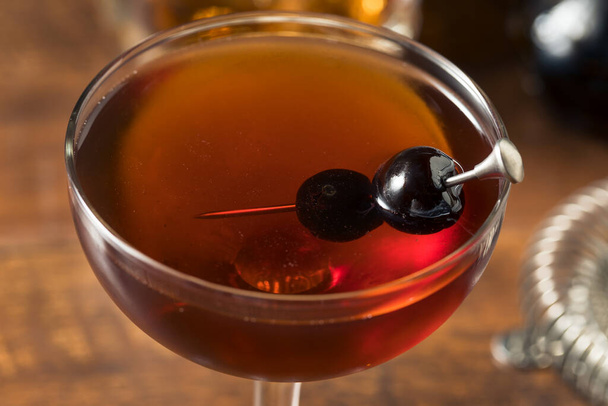 Refreshing Boozy Manhattan Cocktail with Vermouth and Cherry Garnish - Fotoğraf, Görsel