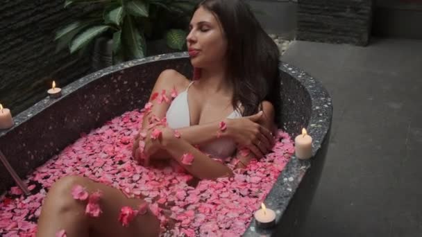 In the hugs of flowers. Day spa relaxing bath - Footage, Video