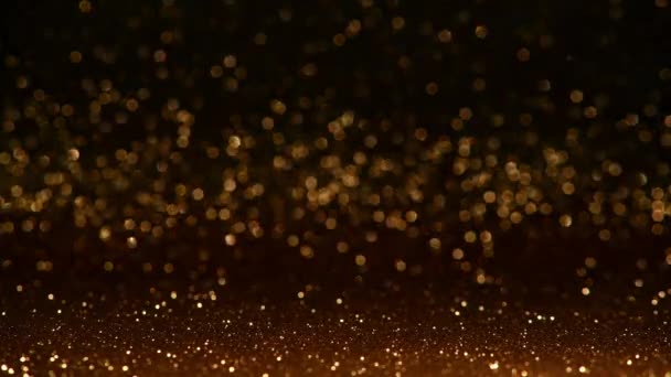 dark golden glitter background with in focus and out of focus area and  reflections in the bokeh with movement - Footage, Video