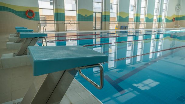 Sports swimming pool Standing water sports swimming water water lanes, surface shooting water ripples RUSSIA, MOSCOW - AUG 23, 2020 - Фото, зображення