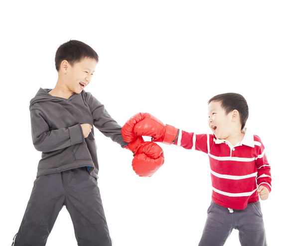 two boys fighting with boxing gloves. - 写真・画像