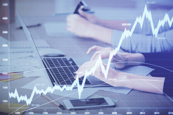 Multi exposure of woman hands typing on computer and financial chart hologram drawing. Stock market analysis concept. - 写真・画像
