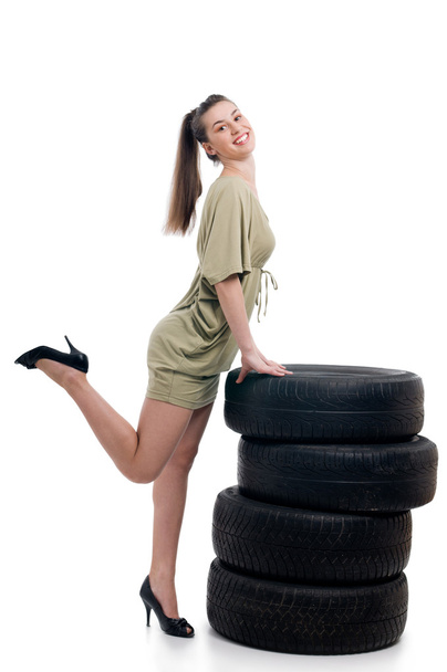 Tire and woman - Фото, изображение