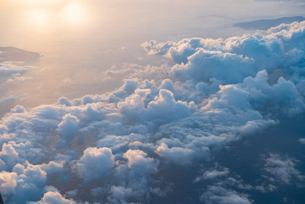 View of the sea and clouds seen from a passenger plane - Photo, Image